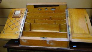 A neat vintage sloped stationery cabinet with compartmented interior and calendar insert Condition