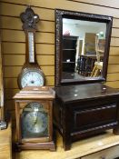 A simple panelled stained wooden box, a reproduction mantel clock with battery operation and an