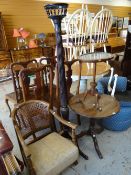 A circular top tripod table, a tapestry top tripod table, an antique torchiere and a cane back chair