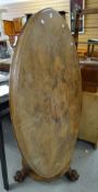 A nineteenth century walnut oval tilt-top breakfast table on claw supports Condition reports