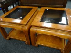 A pair of Eastern-style square glass topped coffee tables Condition reports provided on request by