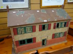 A vintage doll's house in the form of a French-style farmhouse together with tripod planter stand