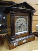An architectural mahogany mantel clock retailed by Freemans & Sons, Merthyr with gilt decoration