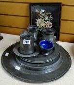 A nineteenth century needlework floral panel and a parcel of pewter chargers and tankards ETC