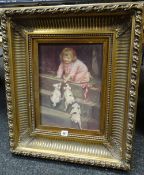 Gilt framed print of a young child with puppies, 39 x 29cms Condition reports provided on request by