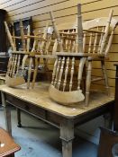A rustic pine breakfast table with drawer and 4+1 spindle back chairs, 148 x 89cms Condition reports