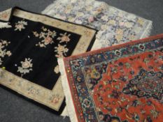Two Chinese woollen rugs together with a believed silk patterned rug Condition reports provided on