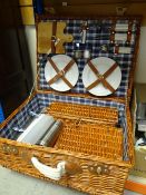 Modern wicker picnic hamper with fitted interior including plates, cutlery, salt and pepper