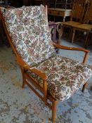 A Parker Knoll floral cushioned armchair Condition reports provided on request by email for this