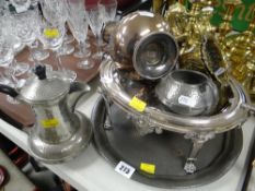 An Edwardian EPNS visor-type revolving tureen and a beaten pewter tray, jug and sugar basin, pair of