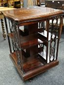 Early twentieth century inlaid mahogany square section revolving bookcase
