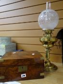 An antique brass oil lamp and a nineteenth century mahogany writing box Condition reports provided