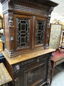 A late nineteenth century carved oak Low-countries type kitchen-dresser of narrow proportions,