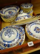 A quantity of Minton's ironstone antique dinnerware in rust and under-glazed blue floral