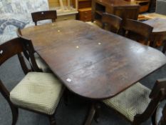 Antique mahogany dining table on three legged supports together with six chairs Condition reports