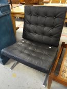 A retro buttoned black chair on chrome supports Condition reports provided on request by email for