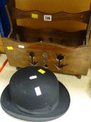 A vintage Repton bowler hat together with a wooden magazine rack Condition reports provided on