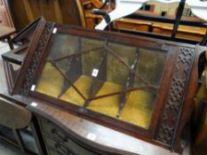 A nineteenth century mahogany narrow hanging corner cabinet with single glazed door and filigree-