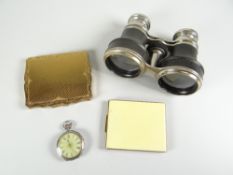Two compacts, one marked Strattan, together with silver fob watch and opera glasses Condition