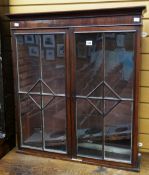 A nineteenth century mahogany hanging cabinet with interior shelves, 78cms high Condition reports
