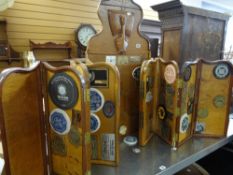 A collection of vintage motor vehicle rally souvenir badges mounted to folding screens Condition