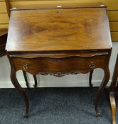An antique reproduction serpentine-front bureau on cabriole supports, 75cms wide Condition reports