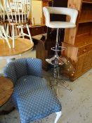 A contemporary nest of three chrome and glass coffee tables together with a chrome and leather