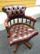 A reproduction studded leather swivel office chair Condition reports provided on request by email