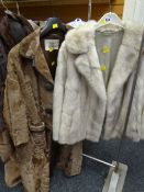 A National Fur Company long hide coat together with a light coloured fur jacket Condition reports