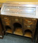 An antique oak pull down kneehole bureau with bank of five drawers Condition reports provided on