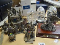 Three Mayflower cut glass paperweights on stands and a collection of seven Myth & Magic ornaments (