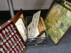 A crate of prints & pictures including MARGARET TARRANT print and a collection of Chaucer spoons ETC