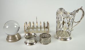 Parcel of silver to include napkin rings (2), six-section toast rack, pierced holder silver stand