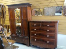 A Victorian bow front mahogany chest of three long & two short drawers with turned handles and an