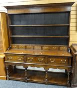 A good twentieth century Welsh dresser, the base with floor level platform having four turned