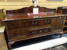 A good Edwardian mahogany railback sideboard of flanking cupboards and two centre drawers with