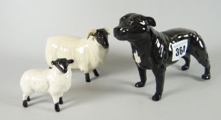 A Beswick black standing French bulldog and another similar black headed and horned sheep with