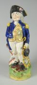 A nineteenth century antique Staffordshire jug modelled as Nelson standing in tricorn hat, 29cms