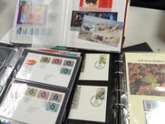 For philatelic collectors a WWF first day covers album, a red Stanley Gibbons album of mixed
