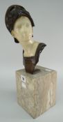 H DIETRICH early twentieth century bronze & alabaster bust - of a young warrior in helmet raised