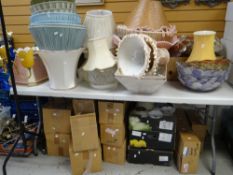 A large quantity of lamp shades ETC (on table and beneath) Condition reports provided on request