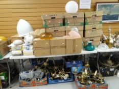 A large quantity of lighting and accessories including chandeliers, fittings and boxed items (on