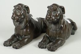A pair of hollow bronze sphinx-type ornaments, 18cms long Condition reports provided on request by