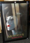 A framed reproduction cinema poster for the 1927 German classic film 'Metropolis', 102 x 71cms (