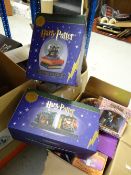 Collection of Harry Potter memorabilia including Harry Potter snow globe, desk clock, 9 3/4