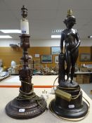 A figural table lamp in the form of a female nude and a classical-type architectural circular