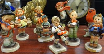 Eight Goebel infant figurines together with a Goebel robin red-breast on a bough Condition reports