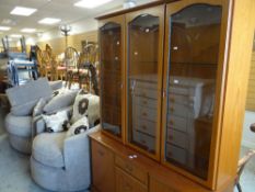 A modern bookcase cupboard with etched glass top, 131cms wide, together with an as new lounge