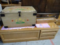 A lightwood entertainment side unit, a painted pine trunk and a tile-back towel airer for wall