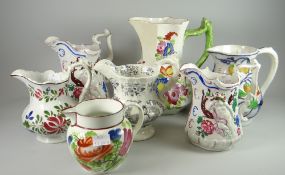 A collection of Welsh pottery jugs including large Swansea twig-handle jug, Opaque China transfer